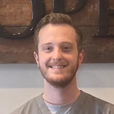 Landon Norgaard smiling in scrubs